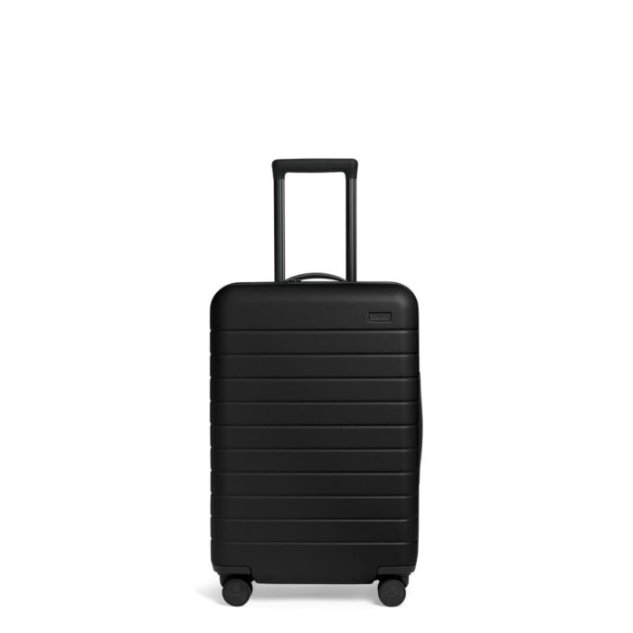 The Bigger Carry-On Flex in Black by Away - Work Well Daily